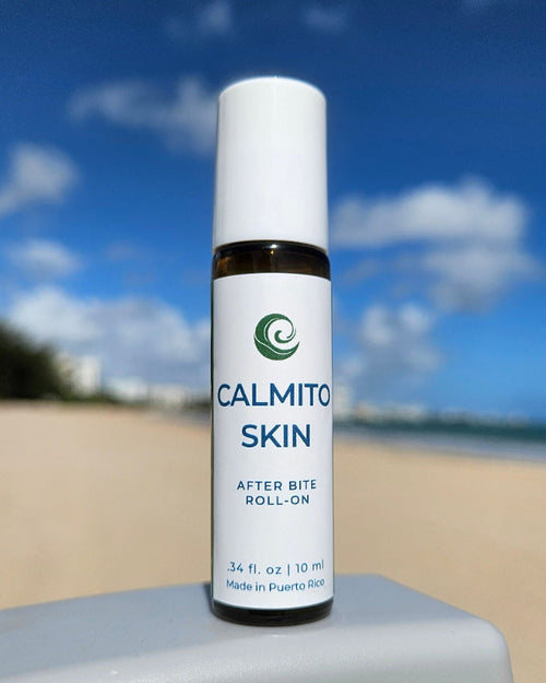 Bottle of Calmito Skin Rollon on the beach chair